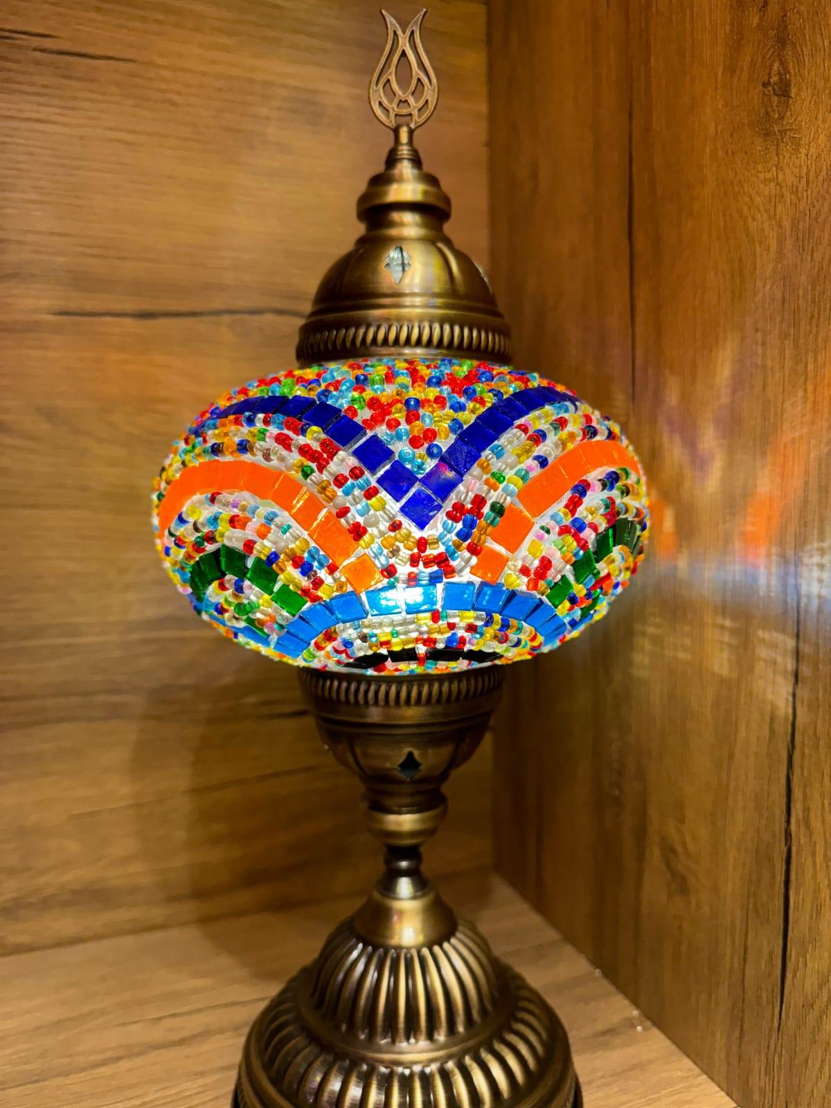 Vibrant multicolour mosaic table lamp with wave pattern on a brass base